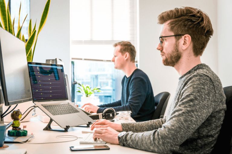 Two men working in an office, enjoying Truespeed's ultrafast, ultra-reliable full-fibre broadband