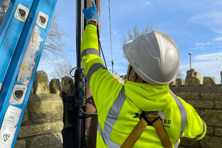 One of our engineers is installing our full-fibre line using an existing phone line pole. We can occasional do this to stop any roads being dug up.