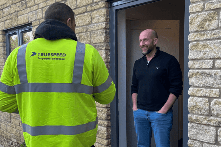 One of our engineers speaking to customer at their door to explain the install process