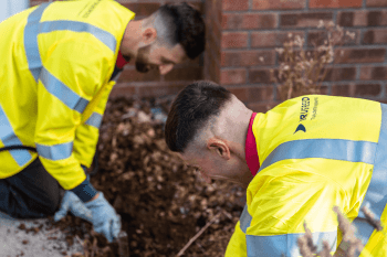 Two Truespeed engineers laying our full-fibre cables at a customer's home