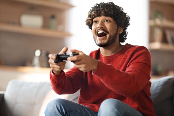 Man at home enjoying Truespeed's ultrafast full-fibre broadband while gaming